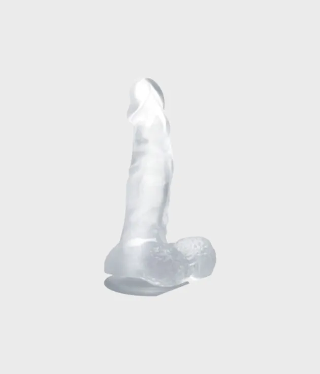 Perfil lateral del dildo transparente mostrando su curvatura y textura